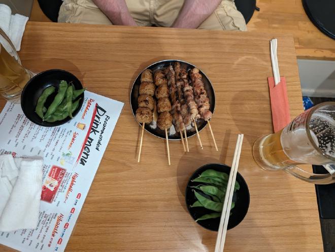 Eating skewers in an Isakaya